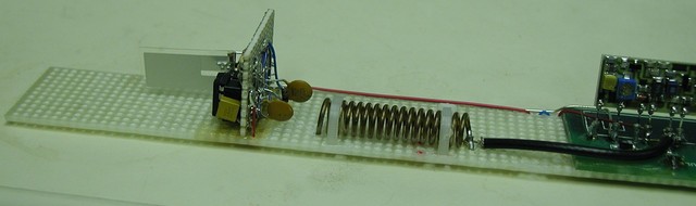First: trying a new antenna. Cut off the end of the board and added something non-metallic, then mounted the coil. Second, trying a new sensor, a piezo accelerometer with an op-amp. We kept the accelerometer, did soemthing else for the antenna.